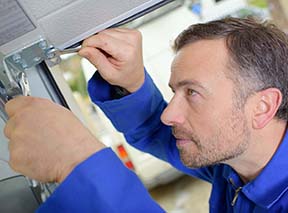 Man installing a garage door